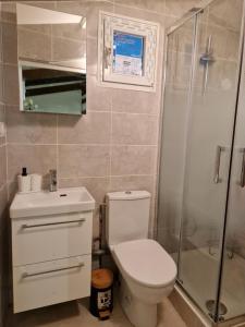 a bathroom with a toilet and a shower at Paris Villette by metro 7, France Stadium, break moment studio in Aubervilliers