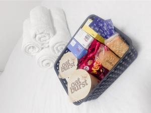 a container filled with snacks and a pile of towels at Cozy haven in Acrefair