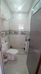 a bathroom with a toilet and a sink at Marjane house in El Jadida
