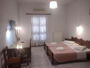 Postel nebo postele na pokoji v ubytování Apollonio Nikopolis