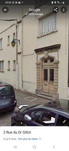 a car parked in front of a building at Charme au milieu de l'histoire in Autun