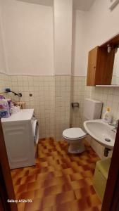 a bathroom with a toilet and a sink at ## Punto FM## in Campalto +16 photos