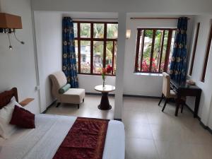 Χώρος καθιστικού στο Jasmin Apartments flic en flac