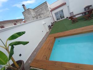 a view from the balcony of a house with a swimming pool at Bed & Relax in Lizzano