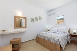 Postel nebo postele na pokoji v ubytování Alamia Suites