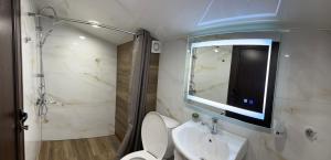 a bathroom with a sink and a toilet and a mirror at Guest House SG-BROTHERS in Obzor +69 photos
