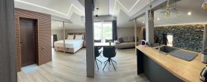 a bedroom and a bedroom with a bed and a kitchen at Guest House SG-BROTHERS in Obzor