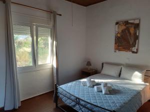 Ένα ή περισσότερα κρεβάτια σε δωμάτιο στο Flampoura Apartments