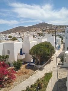 a view of a town with white buildings at Four season in Ios Chora