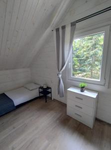 Кровать или кровати в номере Siesta Camp Łeba