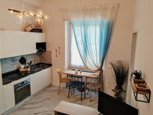 Η κουζίνα ή μικρή κουζίνα στο City Apartment - Il Ghiro