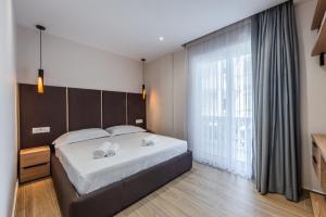 Postel nebo postele na pokoji v ubytování Sea La Vie Suites
