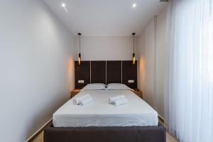 Postel nebo postele na pokoji v ubytování Sea La Vie Suites