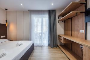 Postel nebo postele na pokoji v ubytování Sea La Vie Suites