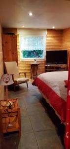 En eller flere senge i et værelse på Appartement fonctionnel