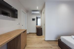 Postel nebo postele na pokoji v ubytování Sea La Vie Suites