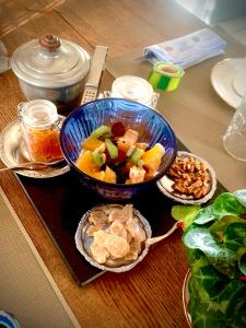 a table with a bowl of food on a table at La FortBelle in Beaufort
