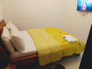 Ένα ή περισσότερα κρεβάτια σε δωμάτιο στο Residence Meublee Les Arcades