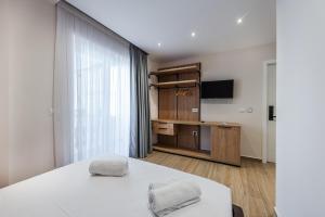 Postel nebo postele na pokoji v ubytování Sea La Vie Suites
