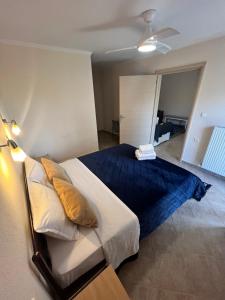 A bed or beds in a room at Queen of Orliaka