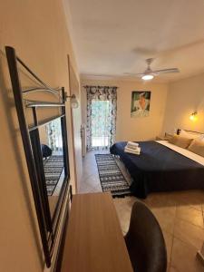 A bed or beds in a room at Queen of Orliaka