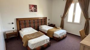 Postel nebo postele na pokoji v ubytování Isly Golf Hotel