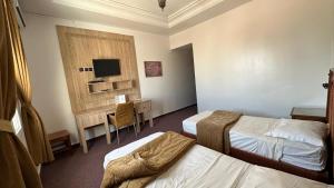 Postel nebo postele na pokoji v ubytování Isly Golf Hotel