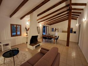 a living room with a couch and a fireplace at Maison de campagne in Bonifacio +20 photos