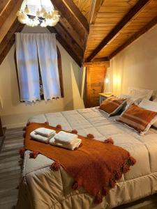 En eller flere senge i et værelse på Abedul, casa de montaña