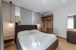 Postel nebo postele na pokoji v ubytování Sea La Vie Suites
