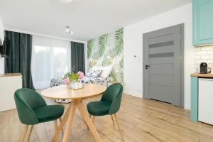 Kuchyň nebo kuchyňský kout v ubytování Akwamaryn Apartamenty