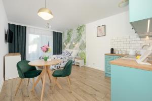 Kuchyň nebo kuchyňský kout v ubytování Akwamaryn Apartamenty