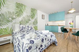 Kuchyň nebo kuchyňský kout v ubytování Akwamaryn Apartamenty