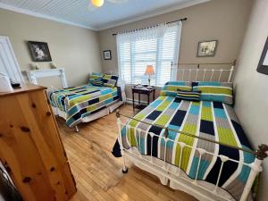 a bedroom with two beds and a window at Kelly's Landing in Trinity