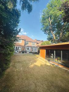 an empty yard in front of a building at Bramble Close in Chalfont Saint Peter