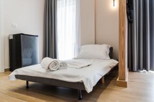 Postel nebo postele na pokoji v ubytování Sea La Vie Suites