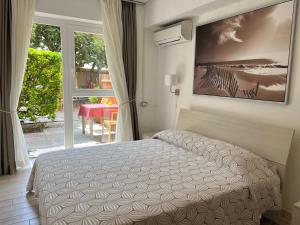 Postel nebo postele na pokoji v ubytování All'Etrusconia Hotel Castagneto Carducci