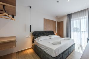 Postel nebo postele na pokoji v ubytování Sea La Vie Suites