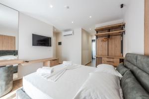 Postel nebo postele na pokoji v ubytování Sea La Vie Suites