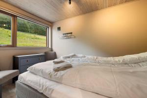 Ένα ή περισσότερα κρεβάτια σε δωμάτιο στο Rorbu