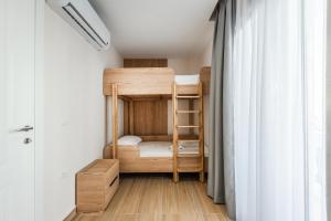 Postel nebo postele na pokoji v ubytování Sea La Vie Suites