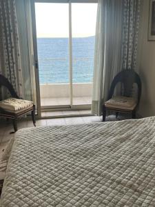 Postel nebo postele na pokoji v ubytování Jane de Cannes