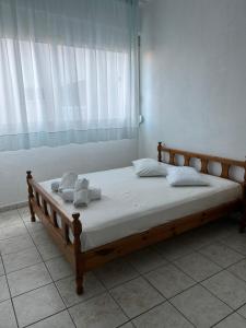 Postel nebo postele na pokoji v ubytování SIROS HOTEL