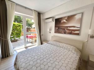 Postel nebo postele na pokoji v ubytování All'Etrusconia Hotel Castagneto Carducci