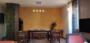a dining room with a table and chairs at Appartement de charme 1860-1900 in Colmar