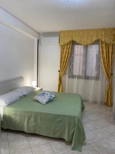Posteľ alebo postele v izbe v ubytovaní CASA VACANZE AMBRA