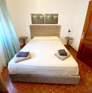 a bedroom with a bed with two pillows on it at Genial casa en centro in Ceuta