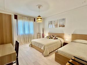 Ένα ή περισσότερα κρεβάτια σε δωμάτιο στο Laura's House