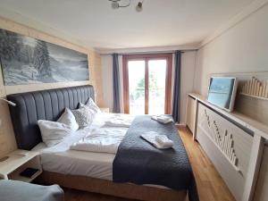 Letto o letti in una camera di Jägerhotel