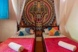 En eller flere senge i et værelse på Casamor Café e Hospedaria Praia de Algodões